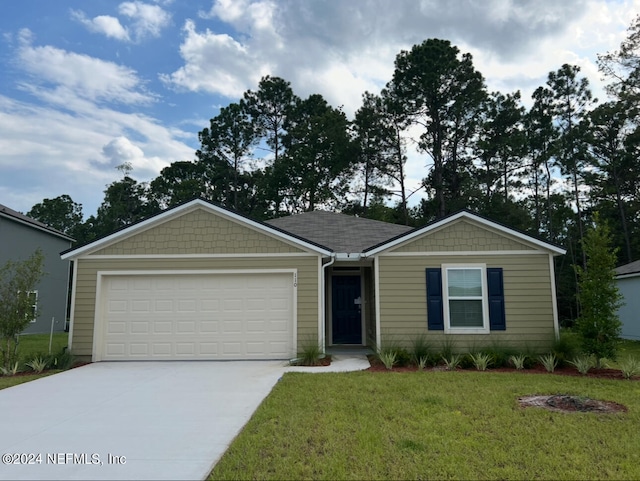 ranch-style home featuring a garage and a front lawn