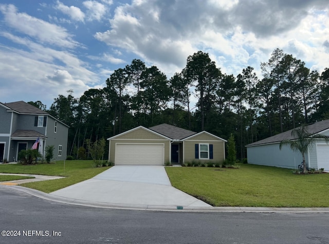 view of front of property featuring a garage and a front lawn