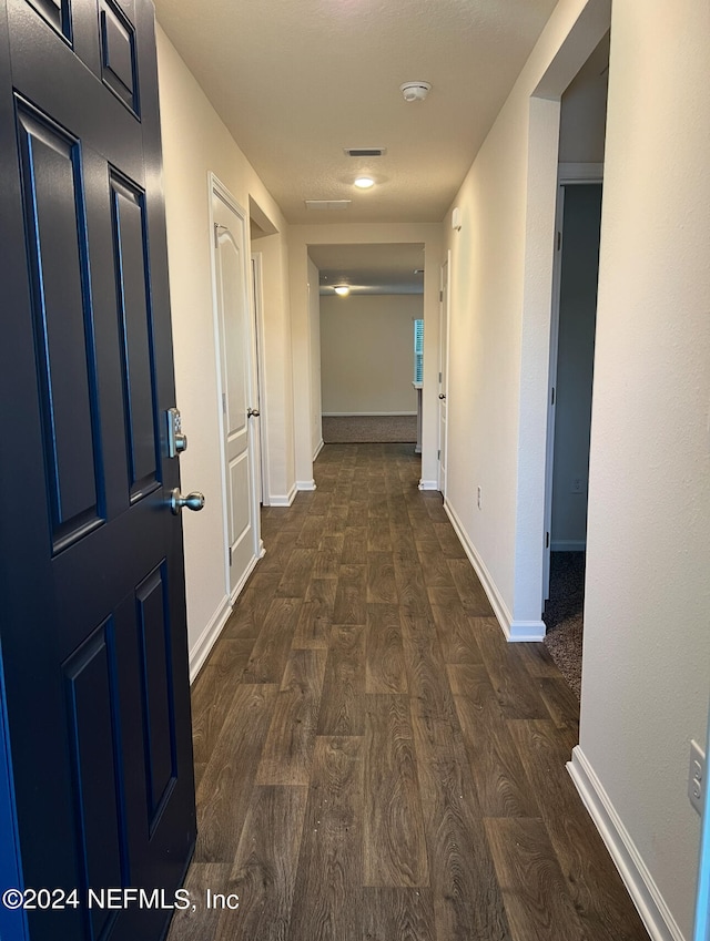 hall featuring dark hardwood / wood-style floors