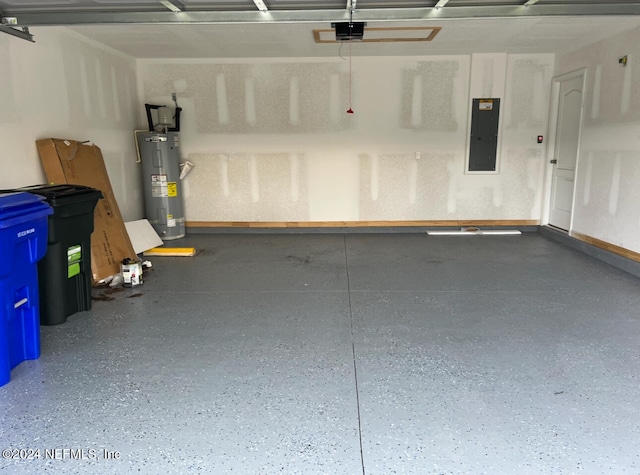 garage featuring water heater, a garage door opener, and electric panel