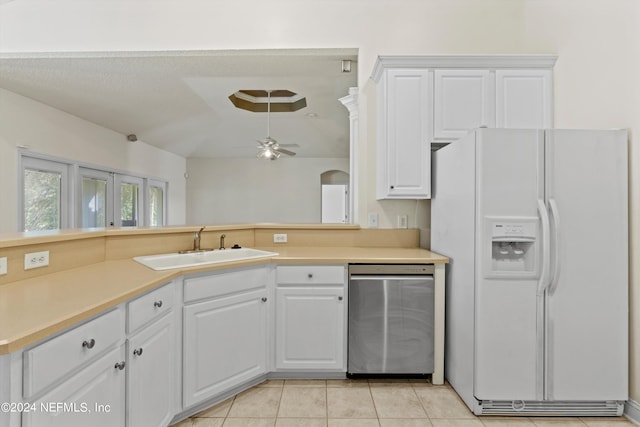 kitchen featuring white fridge with ice dispenser, white cabinets, and dishwasher