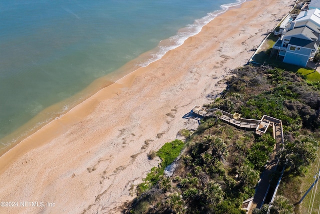 bird's eye view with a view of the beach and a water view