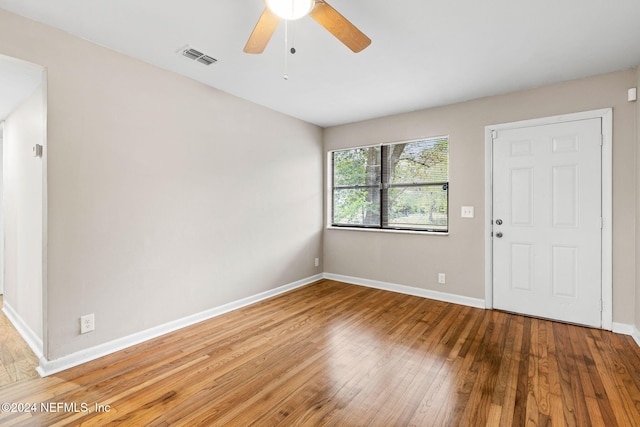 spare room with ceiling fan and hardwood / wood-style floors