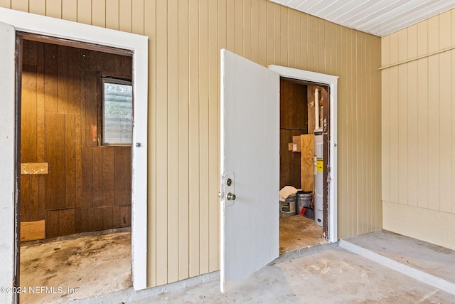 doorway to property featuring electric water heater