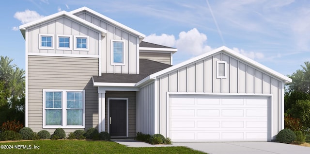 view of front of property featuring a garage and a front lawn