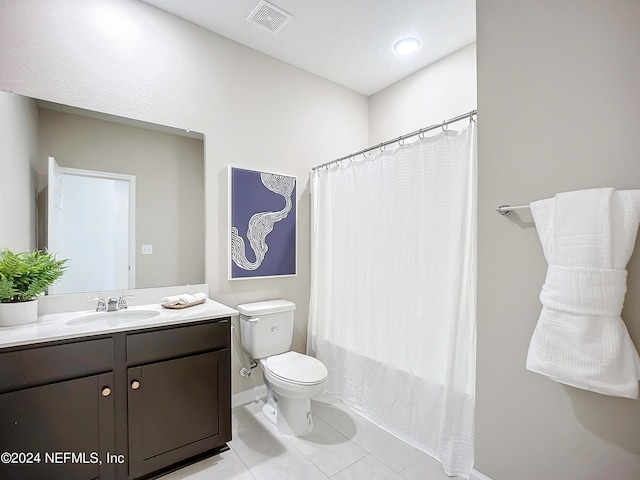 full bathroom with vanity, shower / bath combination with curtain, a textured ceiling, tile patterned flooring, and toilet