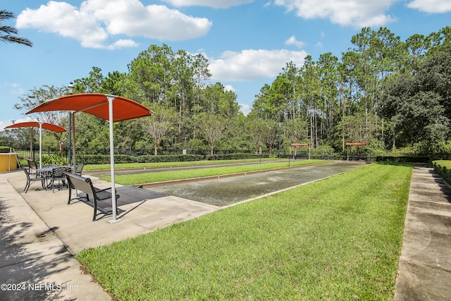 view of property's community with a yard