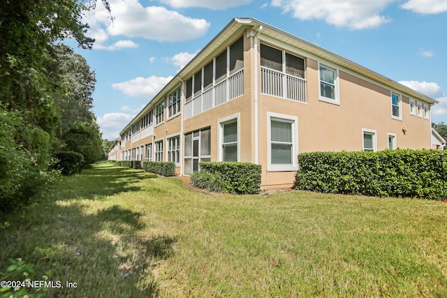 view of home's exterior featuring a yard