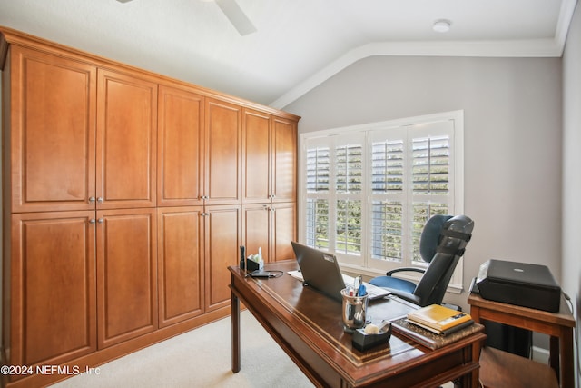 office area with light carpet, vaulted ceiling, ceiling fan, and ornamental molding