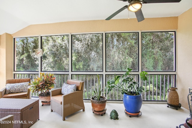 sunroom featuring lofted ceiling, ceiling fan, and a healthy amount of sunlight