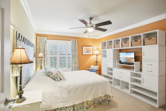 carpeted bedroom with crown molding and ceiling fan