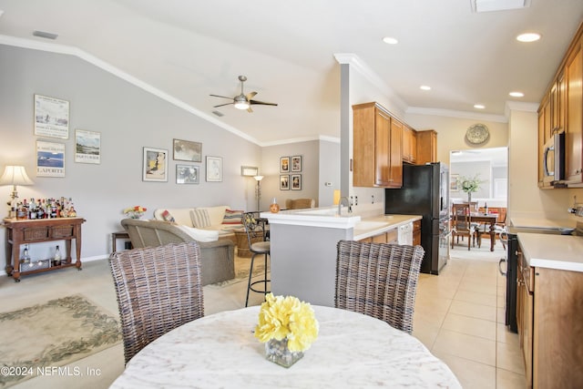 8495 Little Swift Cir, Jacksonville, FL 32256 - dining room featuring ornamental molding, a ceiling fan, and lofted ceiling