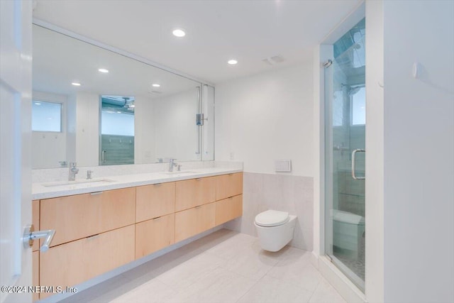 bathroom with tile patterned flooring, vanity, an enclosed shower, and toilet