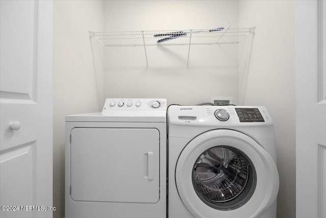 laundry area with separate washer and dryer