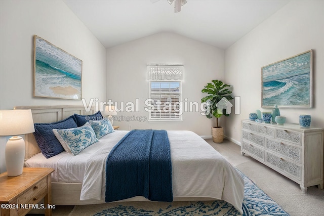 bedroom with vaulted ceiling and light carpet