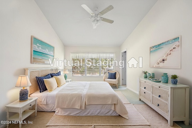 bedroom with light carpet, vaulted ceiling, and ceiling fan