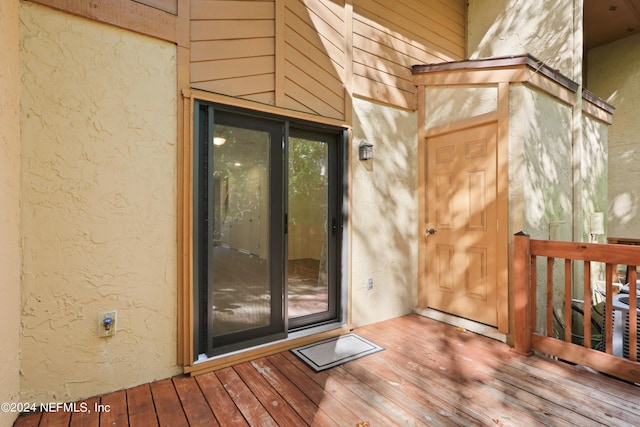 doorway to property with stucco siding