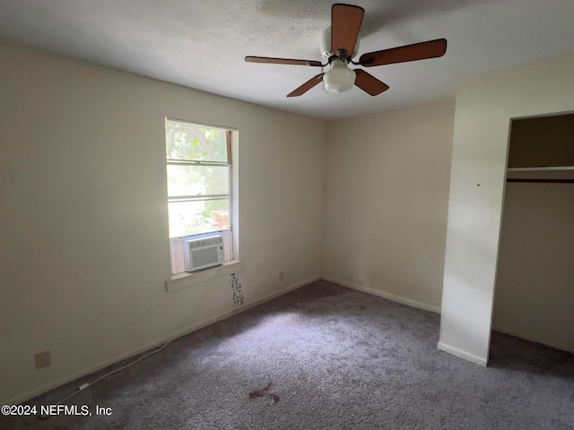 unfurnished bedroom with carpet, cooling unit, ceiling fan, and a closet