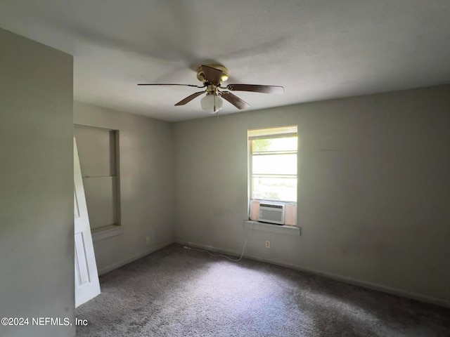 carpeted empty room featuring ceiling fan and cooling unit