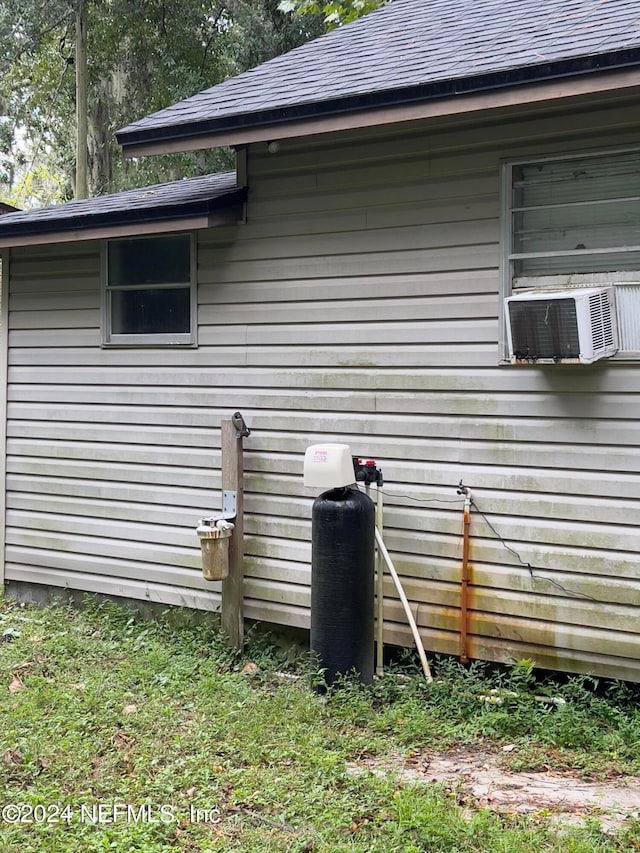 view of side of home with cooling unit