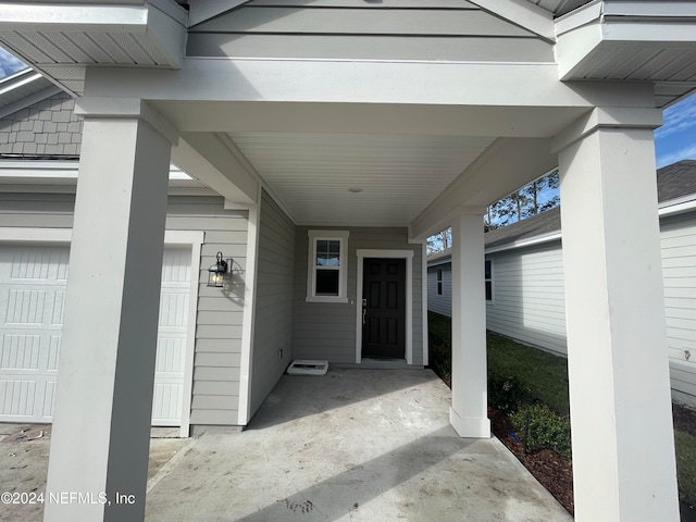 property entrance featuring a garage