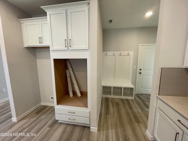 mudroom with dark wood-type flooring