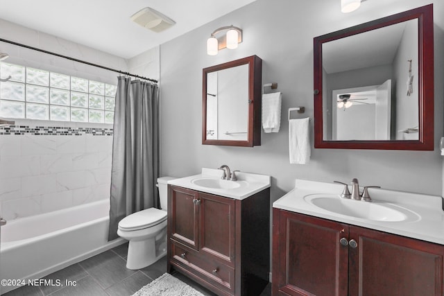 full bathroom featuring shower / tub combo with curtain, vanity, toilet, and ceiling fan