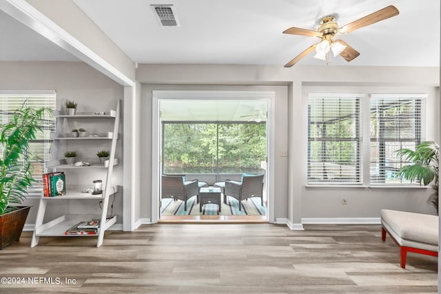 interior space featuring ceiling fan, light hardwood / wood-style floors, and a wealth of natural light