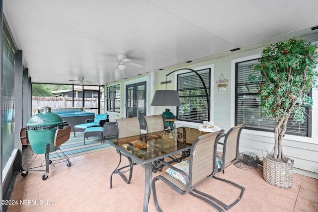 sunroom with a wealth of natural light and ceiling fan