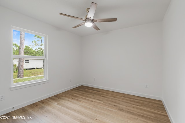 unfurnished room featuring ceiling fan and light hardwood / wood-style flooring