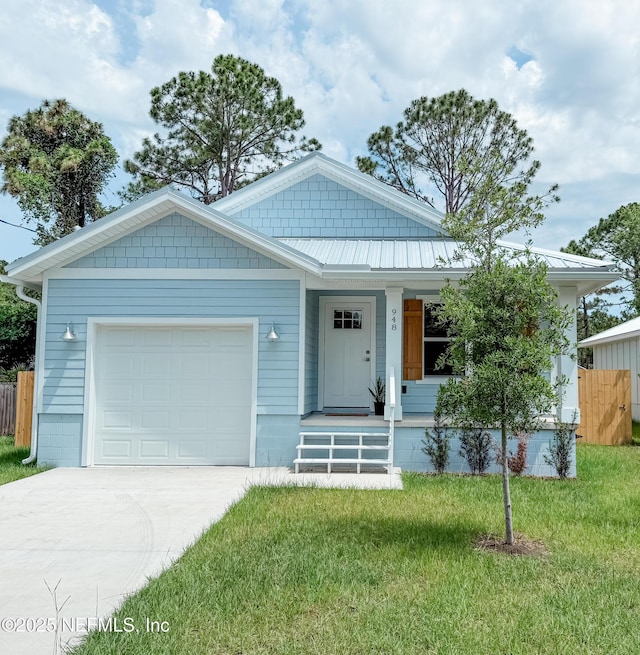 948 Collier Blvd, Saint Augustine, FL 32084 - view of front of house featuring driveway, a garage, and a porch