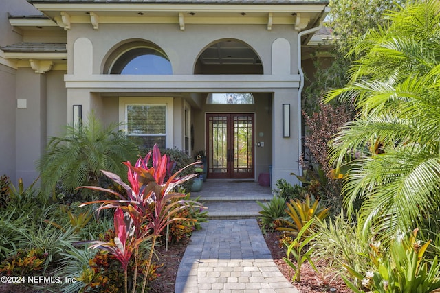 view of exterior entry featuring french doors