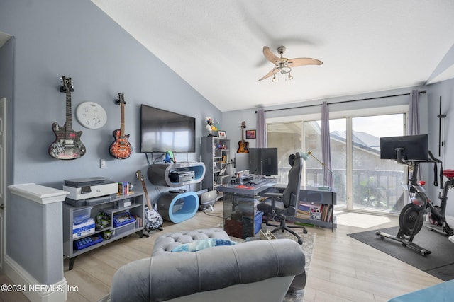 interior space with light hardwood / wood-style flooring, vaulted ceiling, and ceiling fan