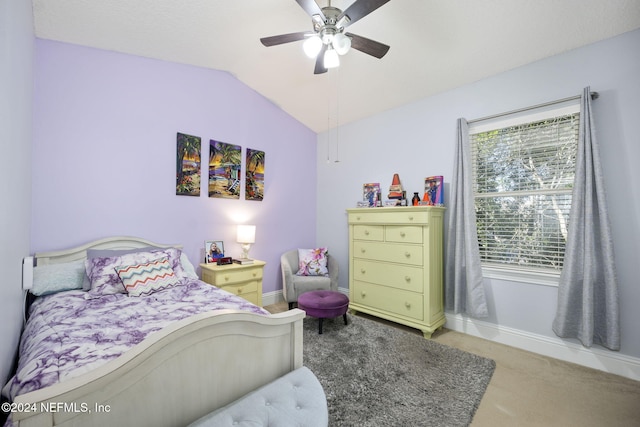 carpeted bedroom with vaulted ceiling and ceiling fan