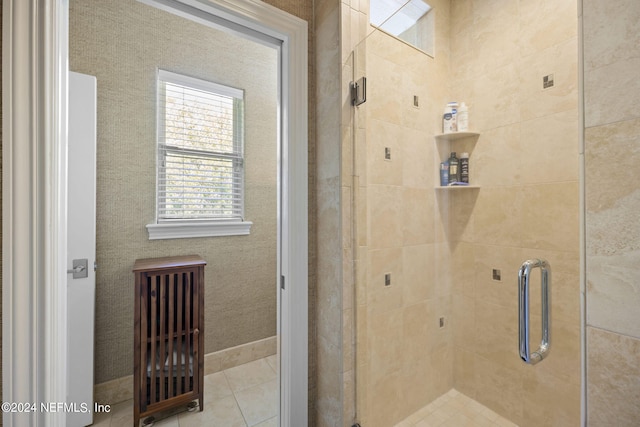 bathroom with a shower with shower door