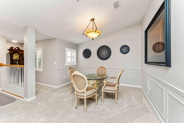 dining area with light colored carpet