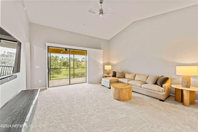 living room featuring lofted ceiling, carpet, and ceiling fan