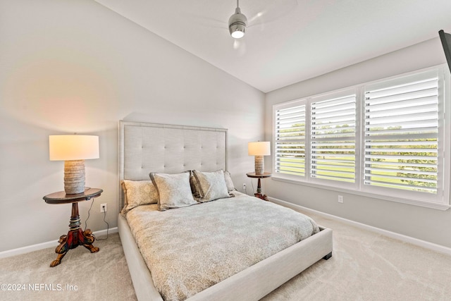 carpeted bedroom with lofted ceiling, multiple windows, and ceiling fan