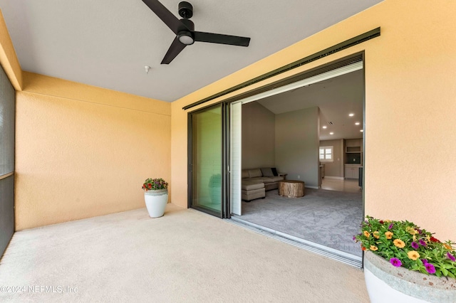 exterior space featuring a ceiling fan