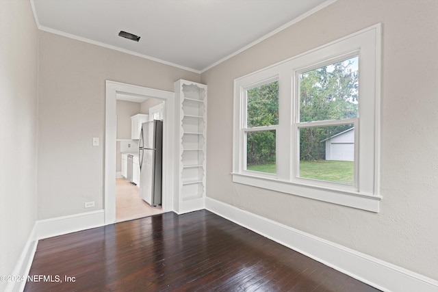 unfurnished room featuring hardwood / wood-style floors and ornamental molding