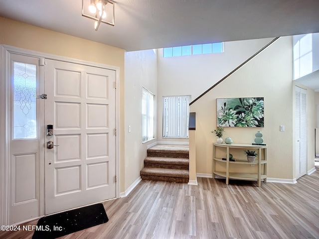 foyer entrance with light hardwood / wood-style floors