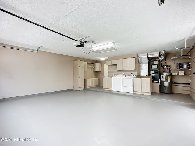 garage with electric water heater, washer and clothes dryer, and a garage door opener