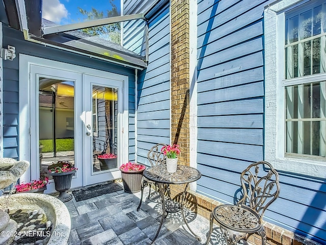 entrance to property featuring french doors