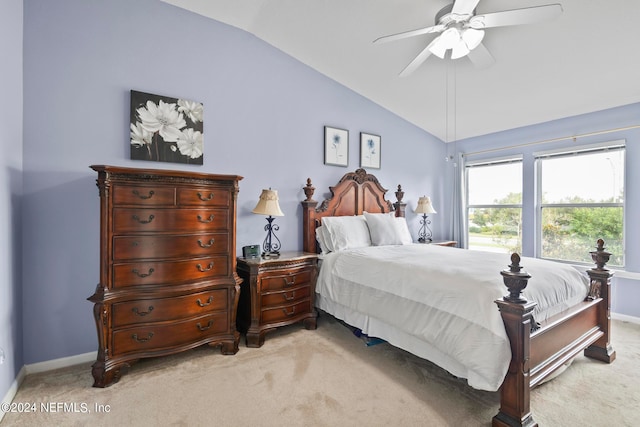 carpeted bedroom with vaulted ceiling and ceiling fan