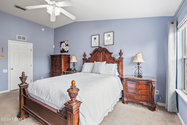 bedroom with ceiling fan, light carpet, and vaulted ceiling