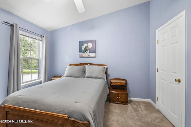 carpeted bedroom featuring ceiling fan