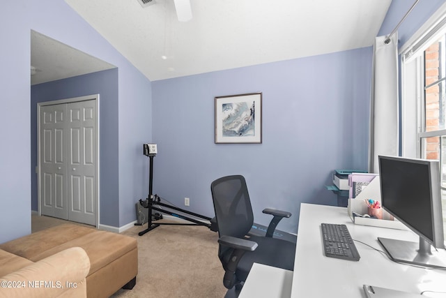 office area featuring light carpet and vaulted ceiling