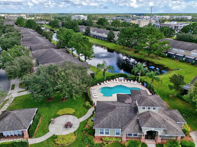 birds eye view of property with a water view