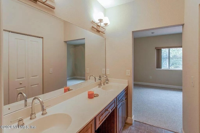 bathroom featuring tile patterned flooring and vanity