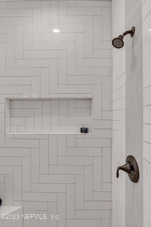 details featuring a tile shower